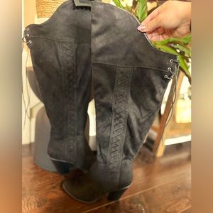 Black faux suede heeled over-the-knee boots.